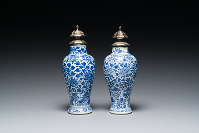 A pair of Chinese blue and white vases with silver mounts, Kangxi