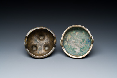 Two Chinese ritual bronze tripod food vessels, 'ding', Western Zhou and Yuan