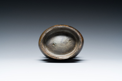 A Chinese inscribed archaic bronze ritual wine vessel, 'zhi', late Shang dynasty