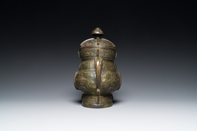 A Chinese archaic bronze ritual wine vessel and cover in Western Zhou-style, 'you', Ming