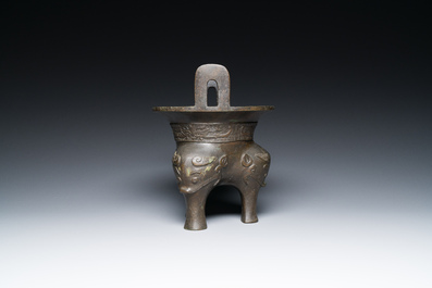 A Chinese archaic bronze tripod censer, 'ding', Ming