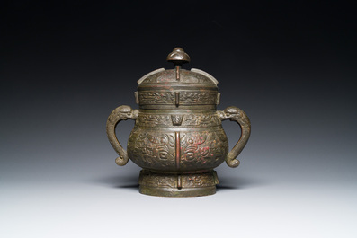 A Chinese archaic bronze ritual wine vessel and cover in Western Zhou-style, 'you', Ming