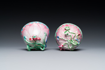 A pair of Chinese relief-decorated famille rose 'lotus' cups and saucers with a scholar and his servant, Yongzheng