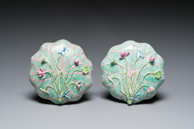 A pair of Chinese relief-decorated famille rose 'lotus' cups and saucers with a scholar and his servant, Yongzheng