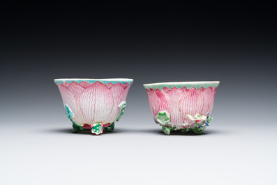 A pair of Chinese relief-decorated famille rose 'lotus' cups and saucers with a scholar and his servant, Yongzheng