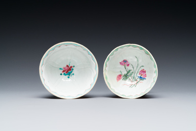 A pair of Chinese relief-decorated famille rose 'lotus' cups and saucers with a scholar and his servant, Yongzheng