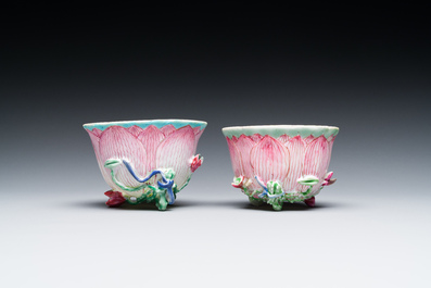 A pair of Chinese relief-decorated famille rose 'lotus' cups and saucers with a scholar and his servant, Yongzheng