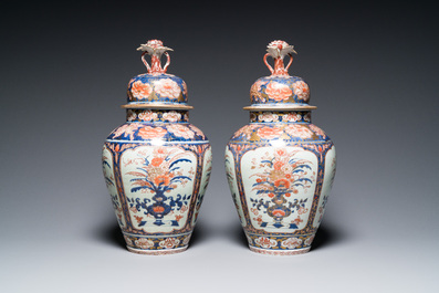 A pair of Japanese Imari vases with flower-topped covers and a large blue and white Arita vase, Edo, 17/18th C.