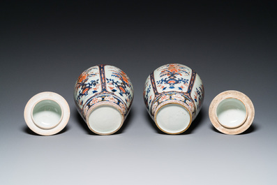 A pair of Japanese Imari vases with flower-topped covers and a large blue and white Arita vase, Edo, 17/18th C.