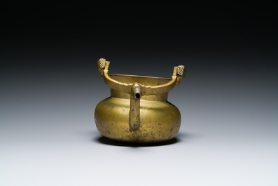 A bronze 'lavabo' water bowl with women's heads on the handles, Flanders, 1st half 15th C.