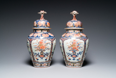 A pair of Japanese Imari vases with flower-topped covers and a large blue and white Arita vase, Edo, 17/18th C.