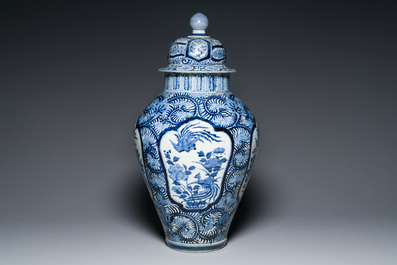 A pair of Japanese Imari vases with flower-topped covers and a large blue and white Arita vase, Edo, 17/18th C.