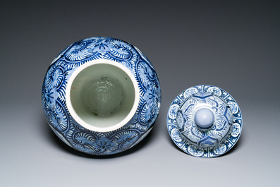 A pair of Japanese Imari vases with flower-topped covers and a large blue and white Arita vase, Edo, 17/18th C.