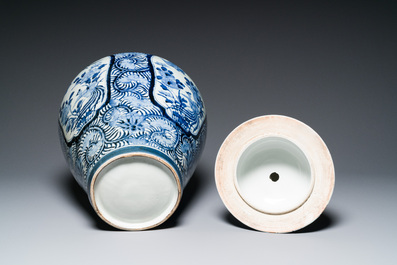 A pair of Japanese Imari vases with flower-topped covers and a large blue and white Arita vase, Edo, 17/18th C.