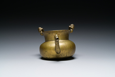 A bronze 'lavabo' water bowl with women's heads on the handles, Flanders, 1st half 15th C.