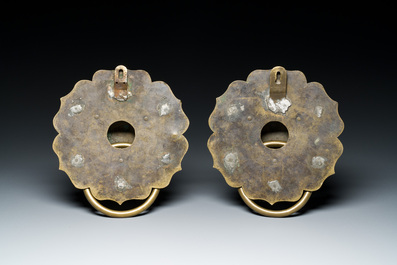 A pair of Chinese brass door knockers with lion heads, 19th C.