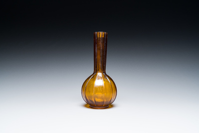 A Chinese translucent amber-coloured Peking glass bottle vase, Qianlong mark and of the period