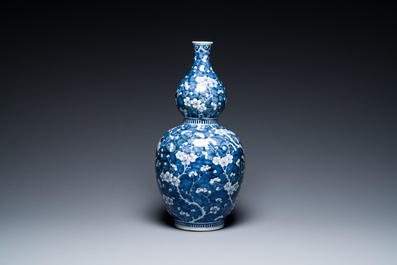 A Chinese blue and white double gourd 'prunus on cracked ice' vase, 18th C.