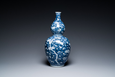 A Chinese blue and white double gourd 'prunus on cracked ice' vase, 18th C.