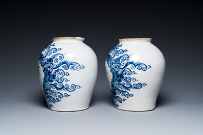 A pair of Dutch Delft blue and white tobacco jars with brass covers, 18th C.