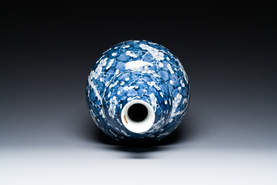 A Chinese blue and white double gourd 'prunus on cracked ice' vase, 18th C.