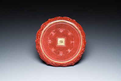 A Chinese red cinnabar lacquer lotus-shaped dish, Qianlong mark, probably Republic