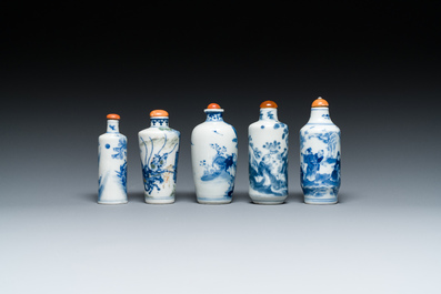 Five Chinese blue, white and wucai snuff bottles, 19th C.