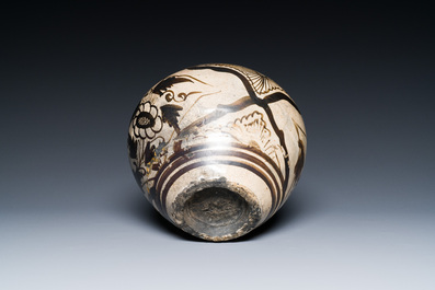 A Chinese Cizhou pottery jar with floral design, Song