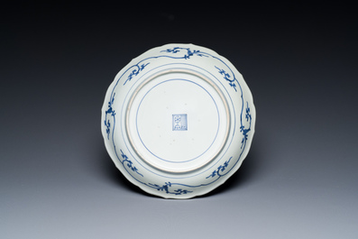 A Japanese blue and white Arita dish with a tiger and a dragon in Kakiemon-style, Fuku mark, Edo, late 17th C.