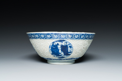 A Chinese blue and white 'Shou Lao' bowl with carved exterior, Chenghua mark, Wanli