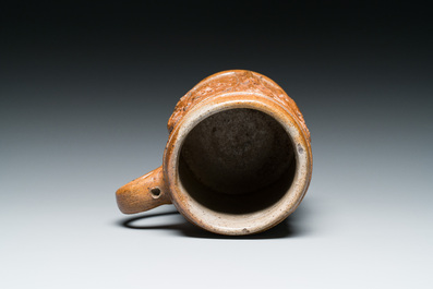 An unusual German stoneware mug depicting king Gambrinus, Cologne or Frechen, ca. 1600