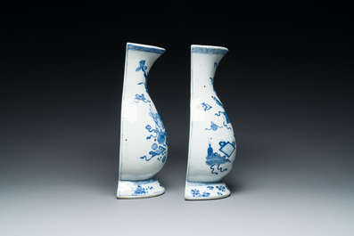 A pair of Chinese blue and white wall pocket vases with antiquities, Kangxi