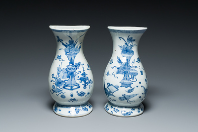 A pair of Chinese blue and white wall pocket vases with antiquities, Kangxi