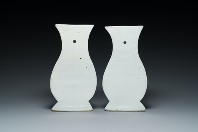 A pair of Chinese blue and white wall pocket vases with antiquities, Kangxi