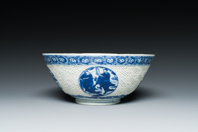 A Chinese blue and white 'Shou Lao' bowl with carved exterior, Chenghua mark, Wanli