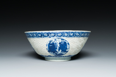 A Chinese blue and white 'Shou Lao' bowl with carved exterior, Chenghua mark, Wanli