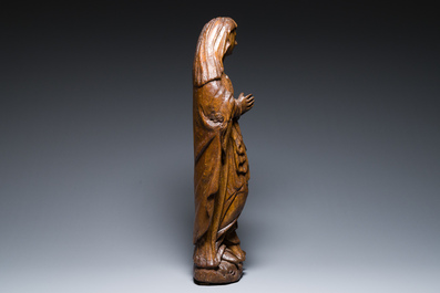 A Flemish carved oak figure of Mary Magdalen from a Crucifixion group, 16th C.