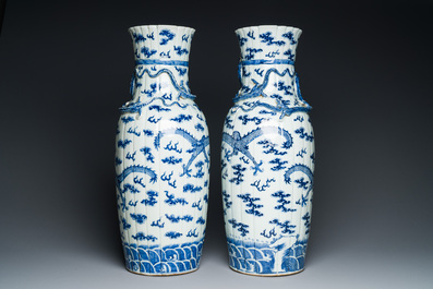 A pair of Chinese blue and white 'dragon' vases, 19th C.