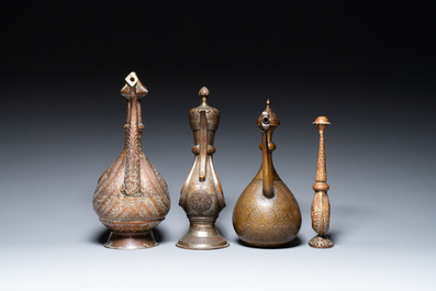 A varied collection of Islamic copper and tin utensils, 19/20th C.