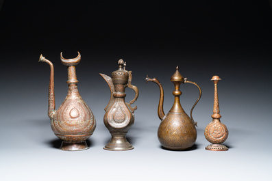 A varied collection of Islamic copper and tin utensils, 19/20th C.