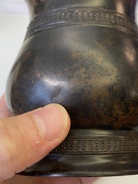 A Chinese inscribed archaic bronze ritual wine vessel, 'zhi', late Shang dynasty