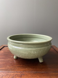 A Chinese Longquan celadon tripod censer with underglaze decoration, Ming