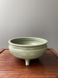 A Chinese Longquan celadon tripod censer with underglaze decoration, Ming