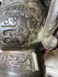 A Chinese archaic bronze ritual wine vessel and cover in Western Zhou-style, 'you', Ming