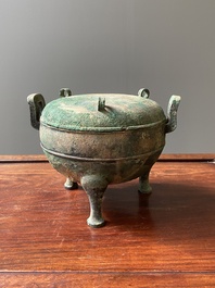 A Chinese archaic bronze tripod vessel and cover, 'ding', Eastern Zhou, Spring and Autumn period