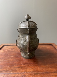 A Chinese archaic bronze ritual wine vessel and cover in Western Zhou-style, 'you', Ming