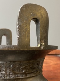 A Chinese archaic bronze tripod censer, 'ding', Ming