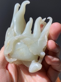 A fine Chinese white jade carving of a Buddha's hand on wooden stand, Qing