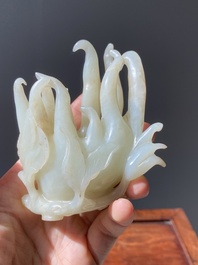 A fine Chinese white jade carving of a Buddha's hand on wooden stand, Qing