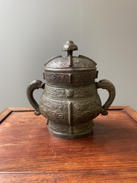 A Chinese archaic bronze ritual wine vessel and cover in Western Zhou-style, 'you', Ming